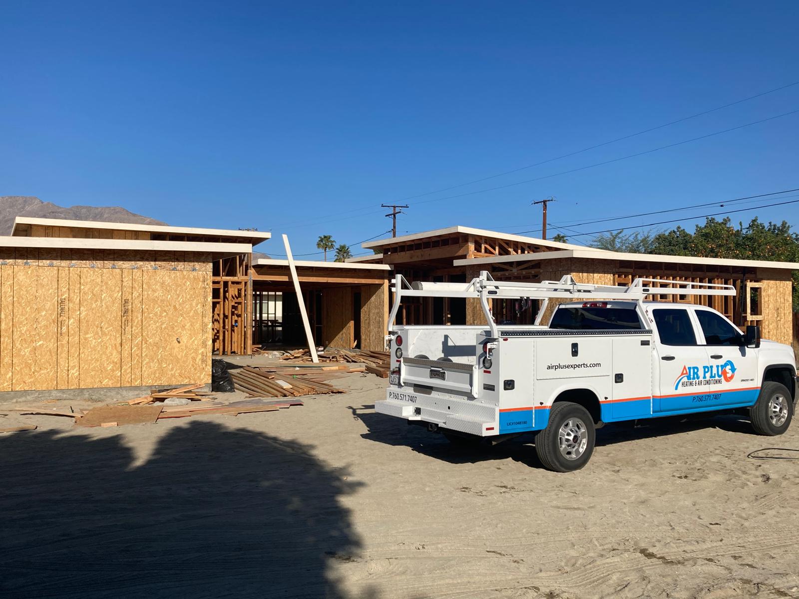 Air Plus truck on site at a new construction HVAC and insulation project